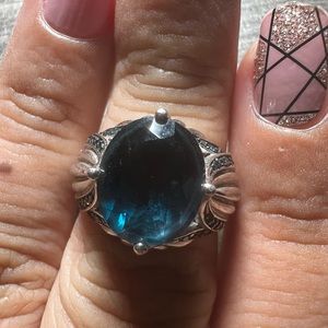 Blue topaz sterling silver ring with small blue diamond throughout